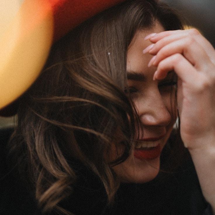 Mira Kapoor, Lead Design Curator at Fresh Field Studio, reviewing corporate floral arrangements